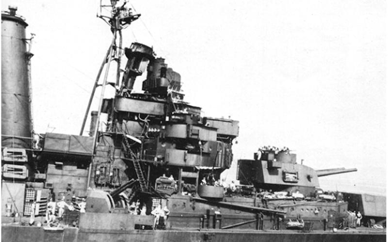 The damage to HMAS Australia’s bridge and foremast following the aerial attack at Leyte Gulf.
