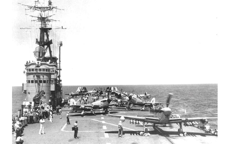 Fireflies readied for launch on HMAS Sydney’s flight deck.