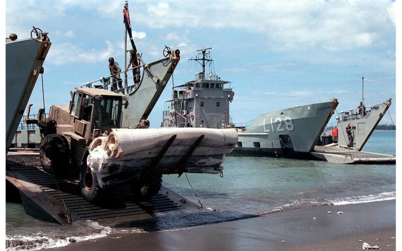 HMAS Labuan and HMAS Balikpapan unloading stores for INTERFET, October 1999.