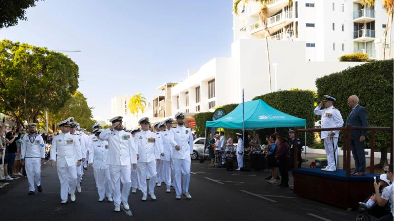 Commanding Officer of Australian Defence Vessel Cape Otway, Lieutenant Commander James Thompson (left), salutes Commanding Officer of HMAS Cairns Commander Alfonso Santos during a Freedom of Entry March in Cairns, Queensland.