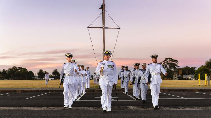 HMAS Cerberus’s Guard marches off upon the completion of a ceremonial sunset.