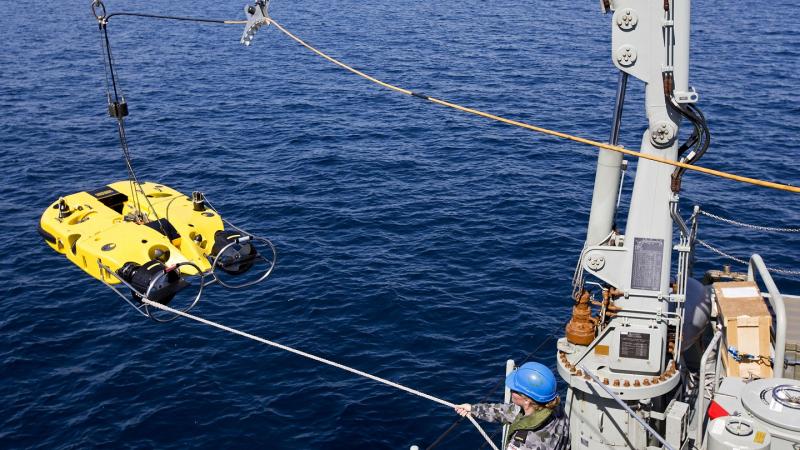 HMAS Huon recovers its Double Eagle Unmanned Underwater Vehicle following a successful mine shape identification.