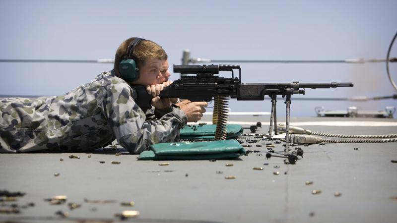 The Boatswain Mate department conduct a Minimi Shoot on the Flight Deck of HMAS SYDNEY.