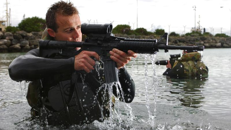 Royal Australian Navy clearance divers carry the M4A1 carbine assault rifle.