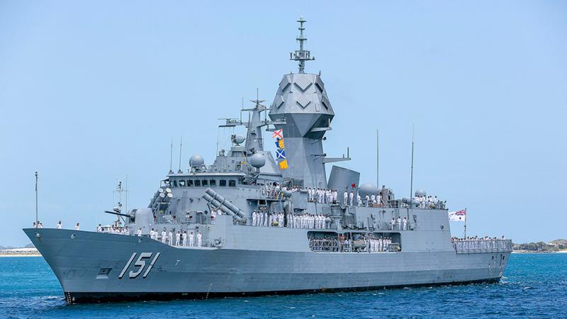 Crew line up on the deck of HMAS Arunta off the coast of Western Australia.
