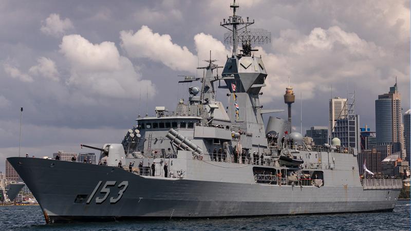 HMAS Stuart with the city buildings of Sydney in the background.